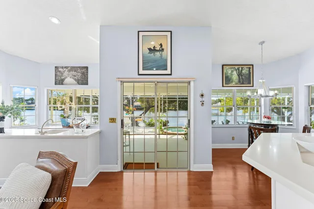 a view of a lake with a tree in the background