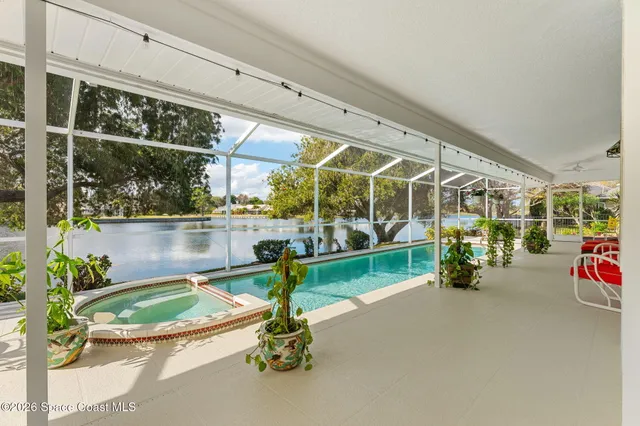 a view of a swimming pool with an outdoor space and seating area