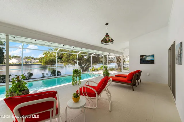 a view of a swimming pool with a yard