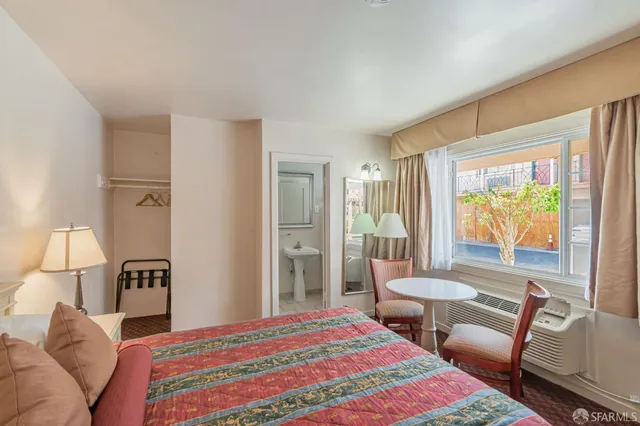 a view of a livingroom with furniture and a window