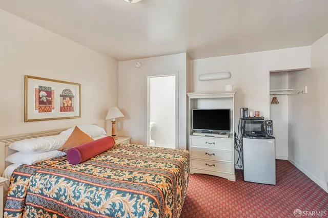 a bedroom with bed and a window