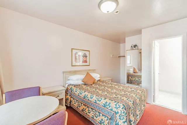 a bathroom with a sink a mirror and a toilet