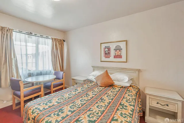 a white toilet sitting next to a bathroom sink