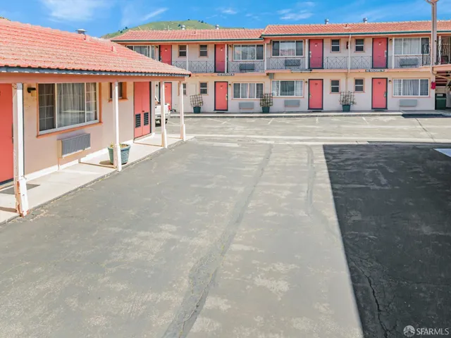 a view of a balcony with seating area