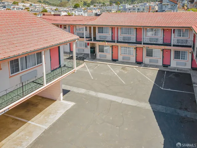 an aerial view of a house with a bed