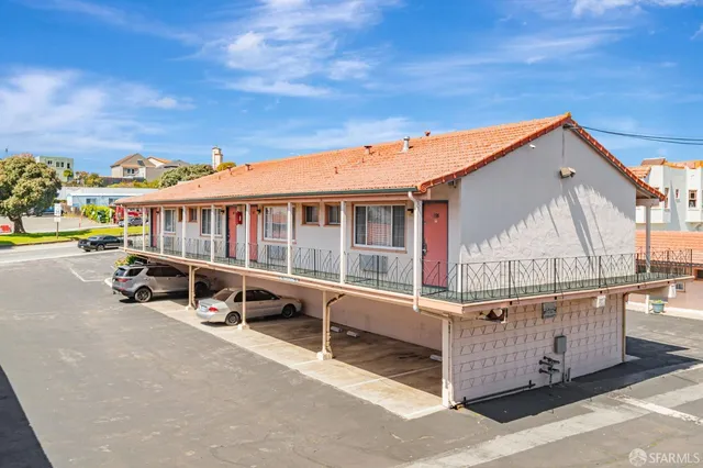a view of a car park in front of a building
