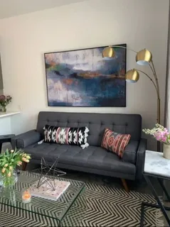 a living room with furniture and rug