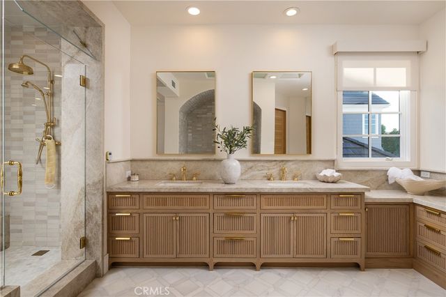 a bedroom with a bed and a mirror