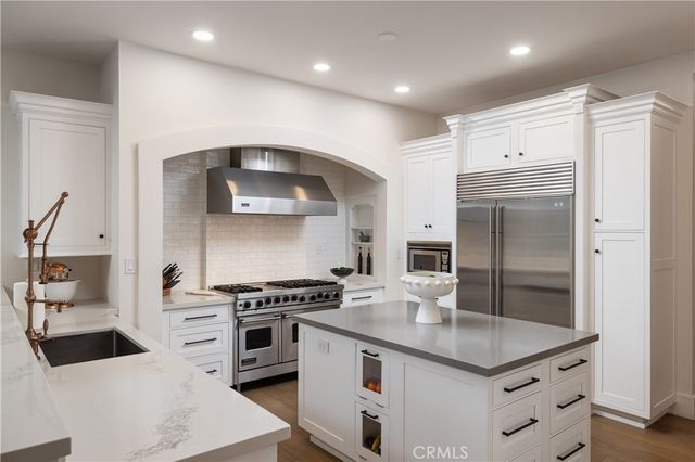 a view of a patio with couches chairs and a fire pit
