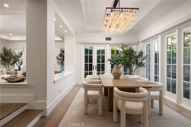 a front view of a house with garden and patio