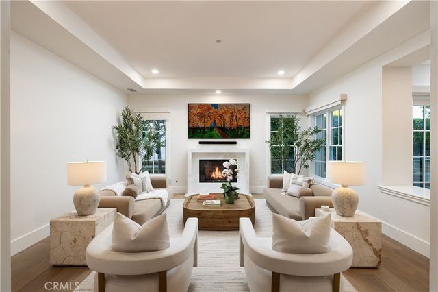 a view of a house with backyard sitting area and garden