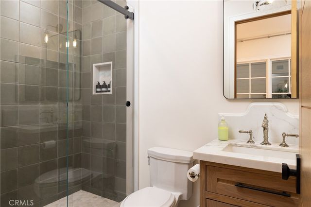 an aerial view of house with yard swimming pool and mountains