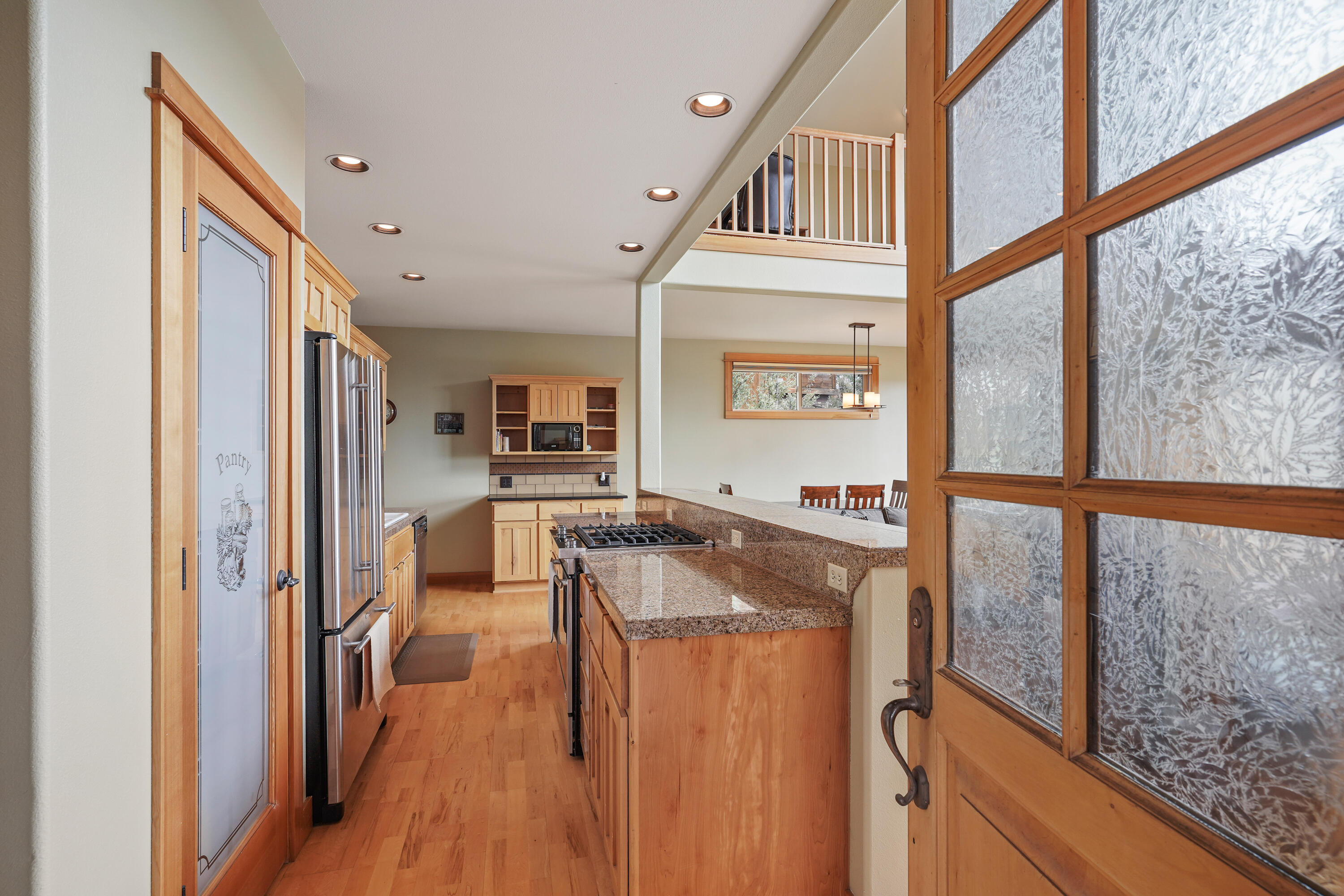2155 Northwest Awbrey Road Bend, OR 97703 - Photo 2 of 44 a kitchen with stainless steel appliances granite countertop a refrigerator and a sink