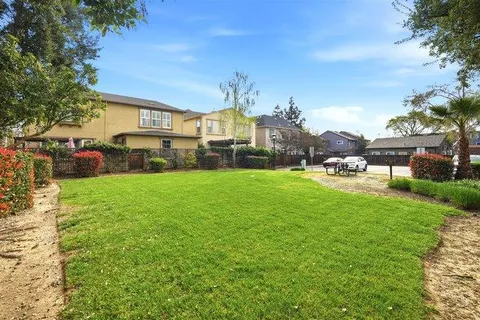 a view of a house with a big yard