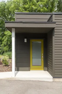 a side view of a house with a garage