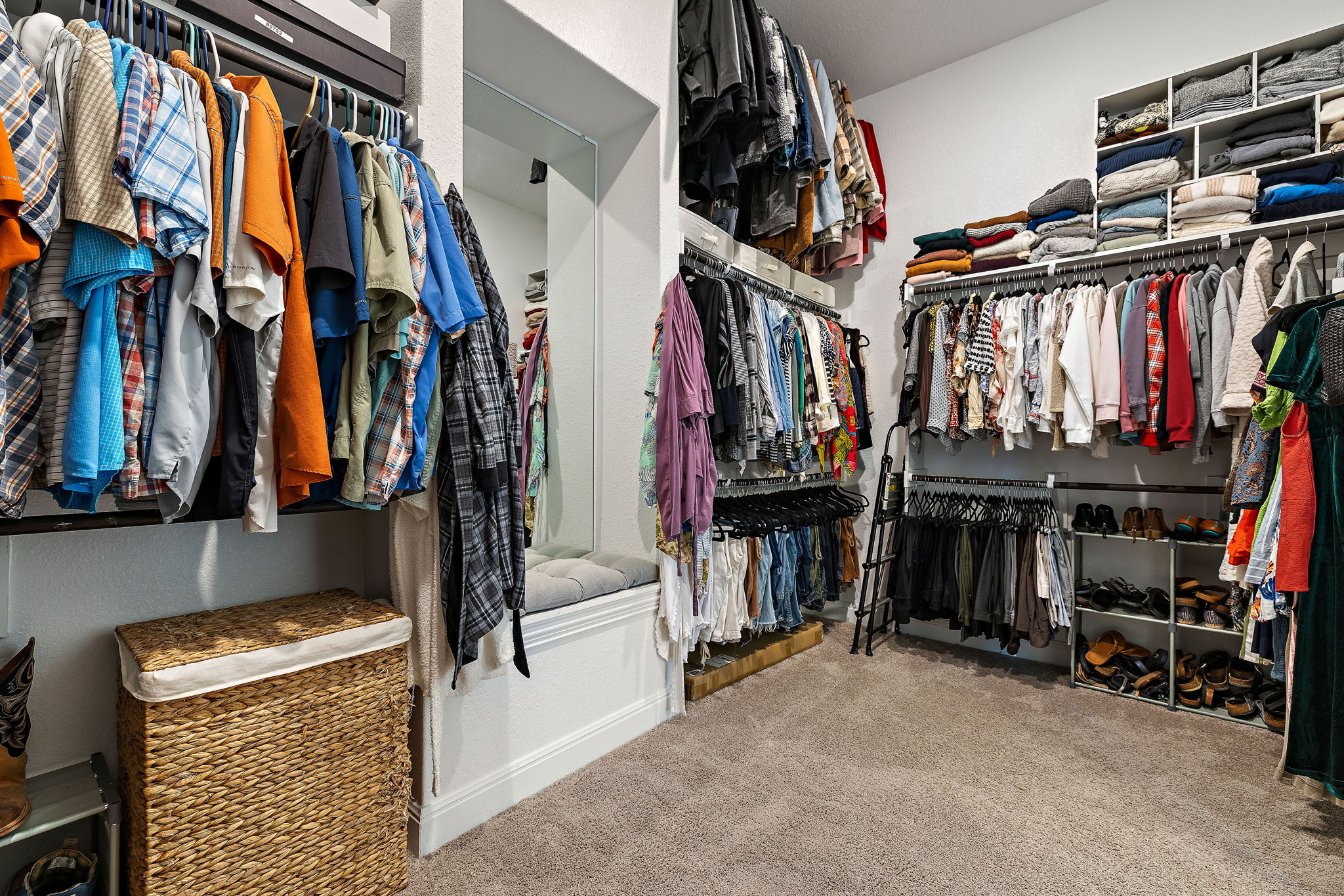181 Constitution Way Kyle, TX 78640 - Photo 22 of 32 a view of walk in closet with clothes and shoes