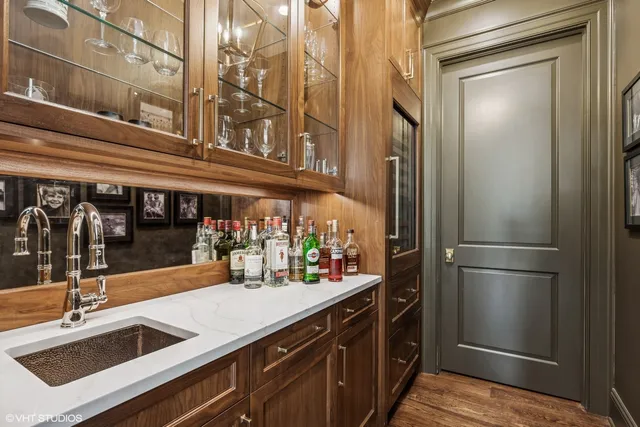 a kitchen with a sink and refrigerator