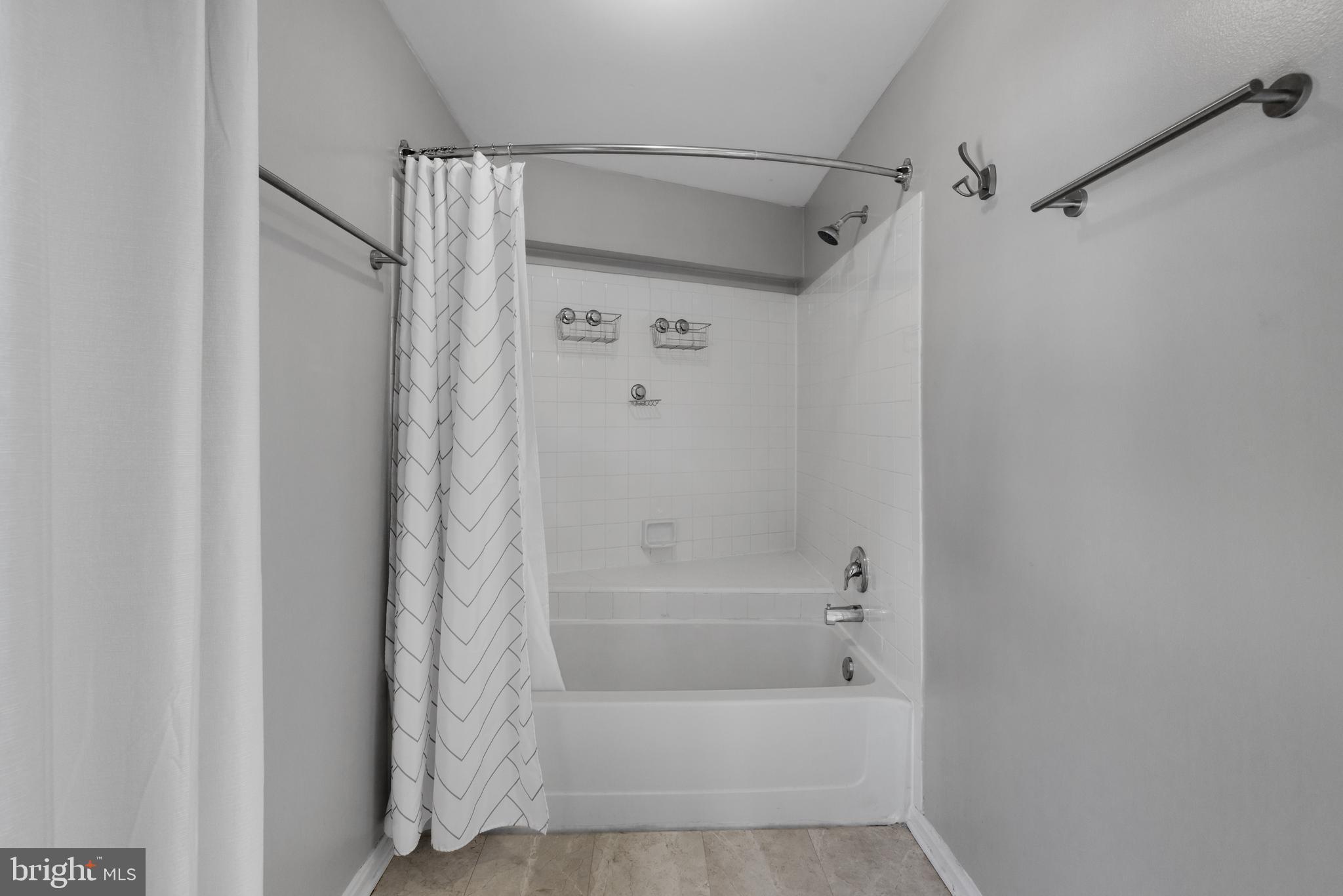 1729 Quietree Drive Reston, VA 20194 - Photo 19 of 22 a bathroom with a bathtub and a shower