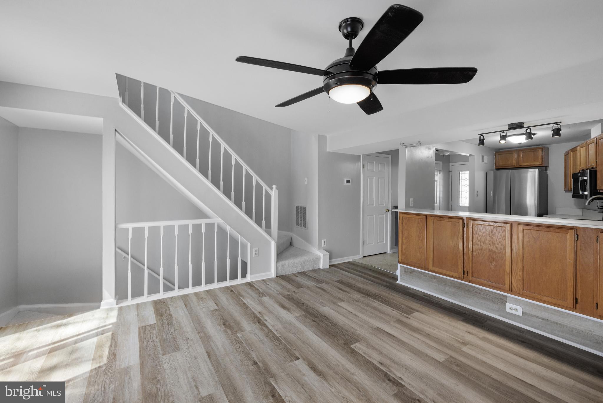 1729 Quietree Drive Reston, VA 20194 - Photo 2 of 22 a view of a living room with wooden floor
