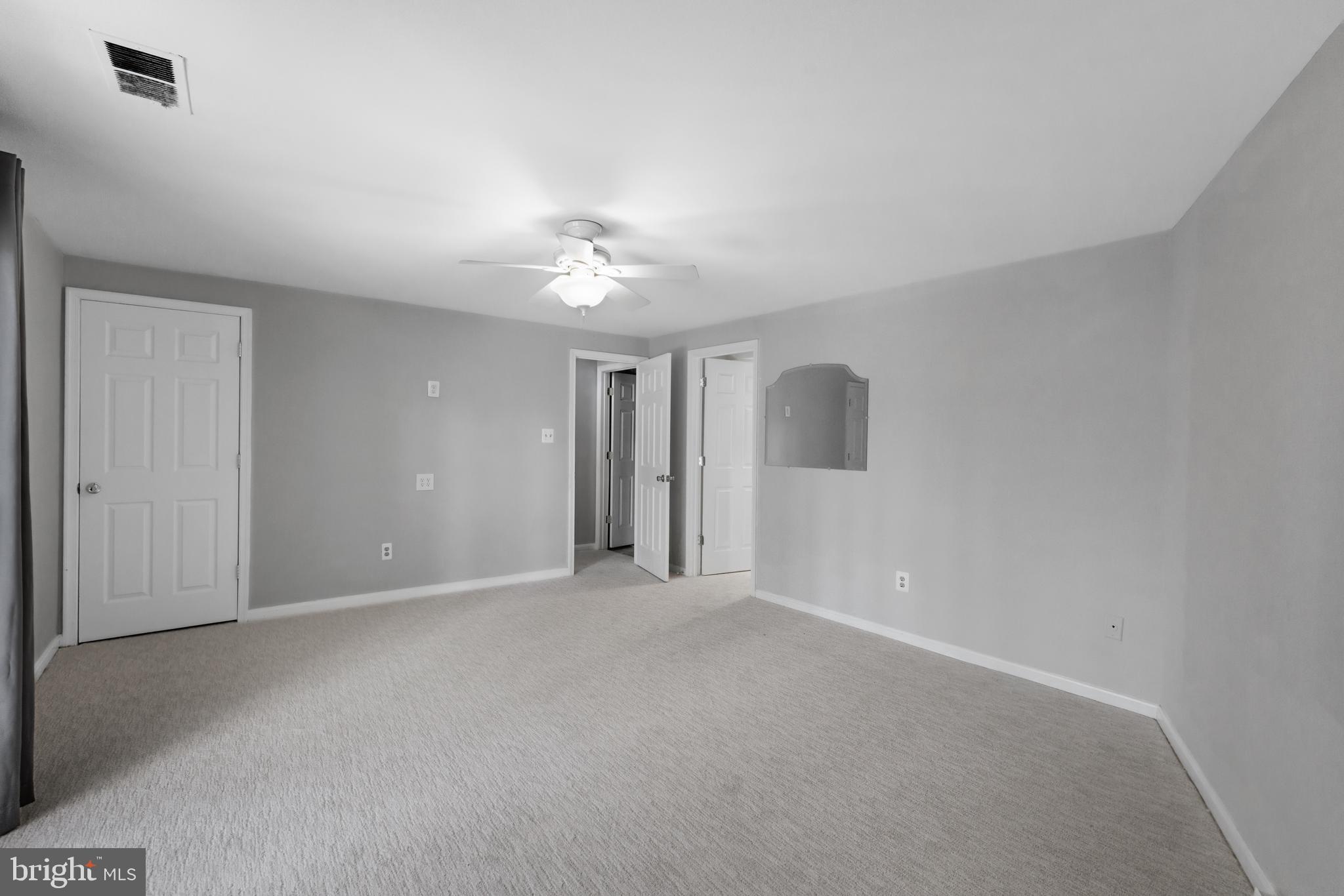 1729 Quietree Drive Reston, VA 20194 - Photo 9 of 22 a view of an empty room with a ceiling fan