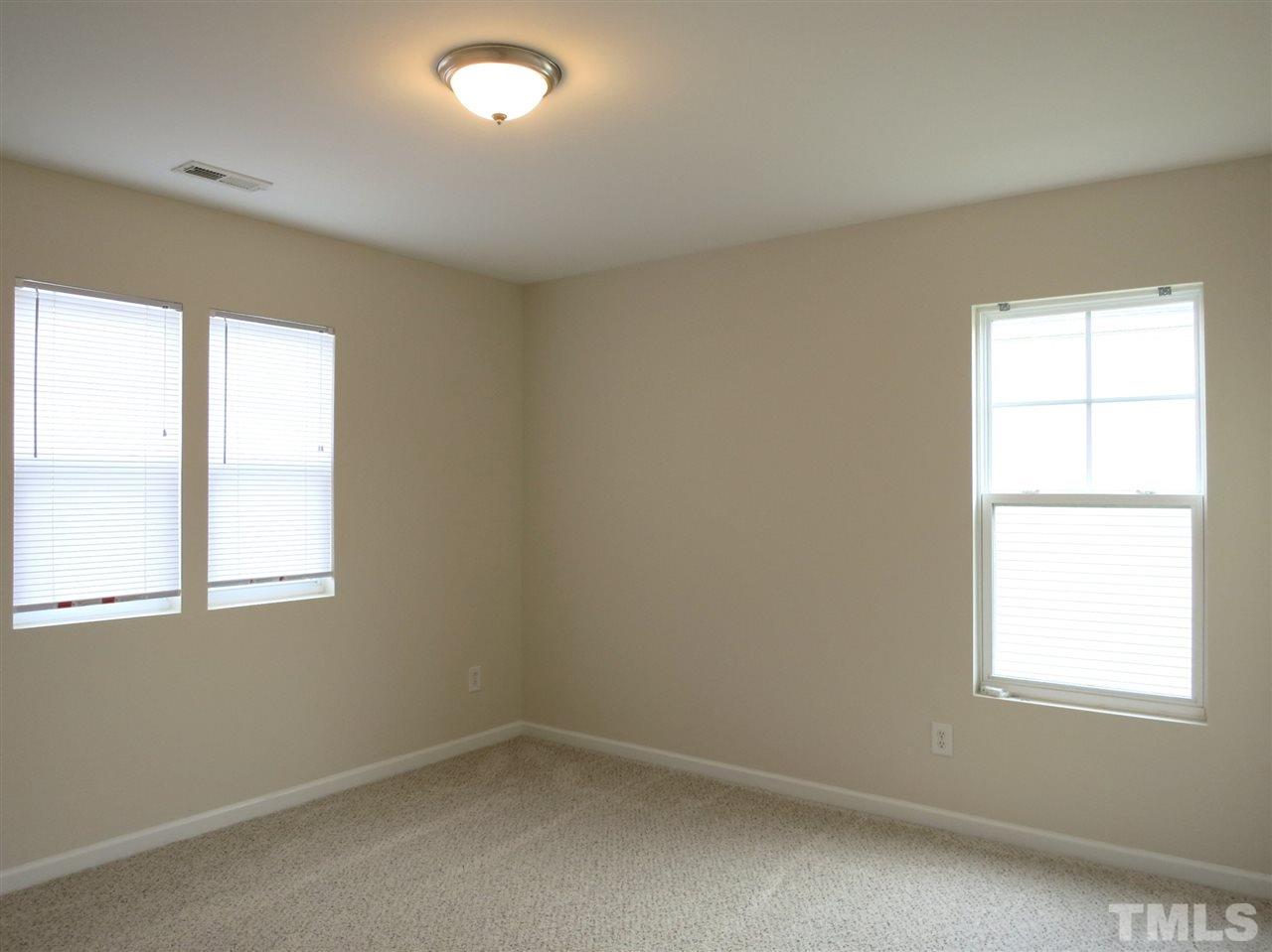 6714 Harter Court Raleigh, NC 27610 - Photo 17 of 25 Bedroom 3 has neutral carpet & lg closet.