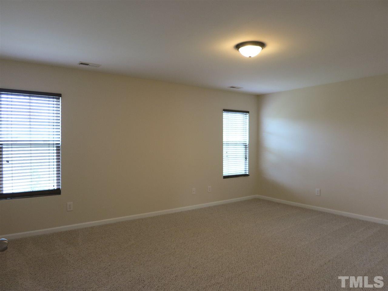 6714 Harter Court Raleigh, NC 27610 - Photo 19 of 25 The Master Bedroom is big w/neutral carpet, huge WIC & private Bath.