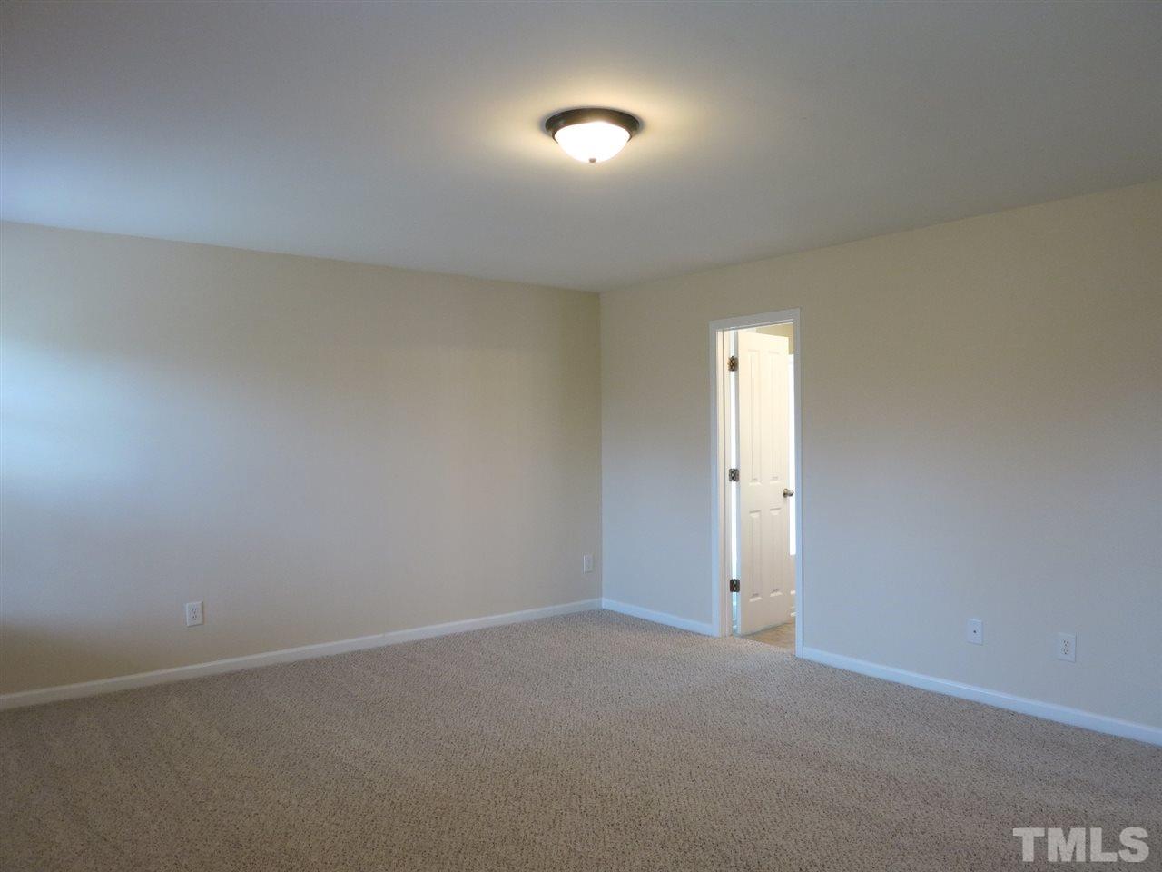6714 Harter Court Raleigh, NC 27610 - Photo 20 of 25 Another view of the very lg Master Bedroom.