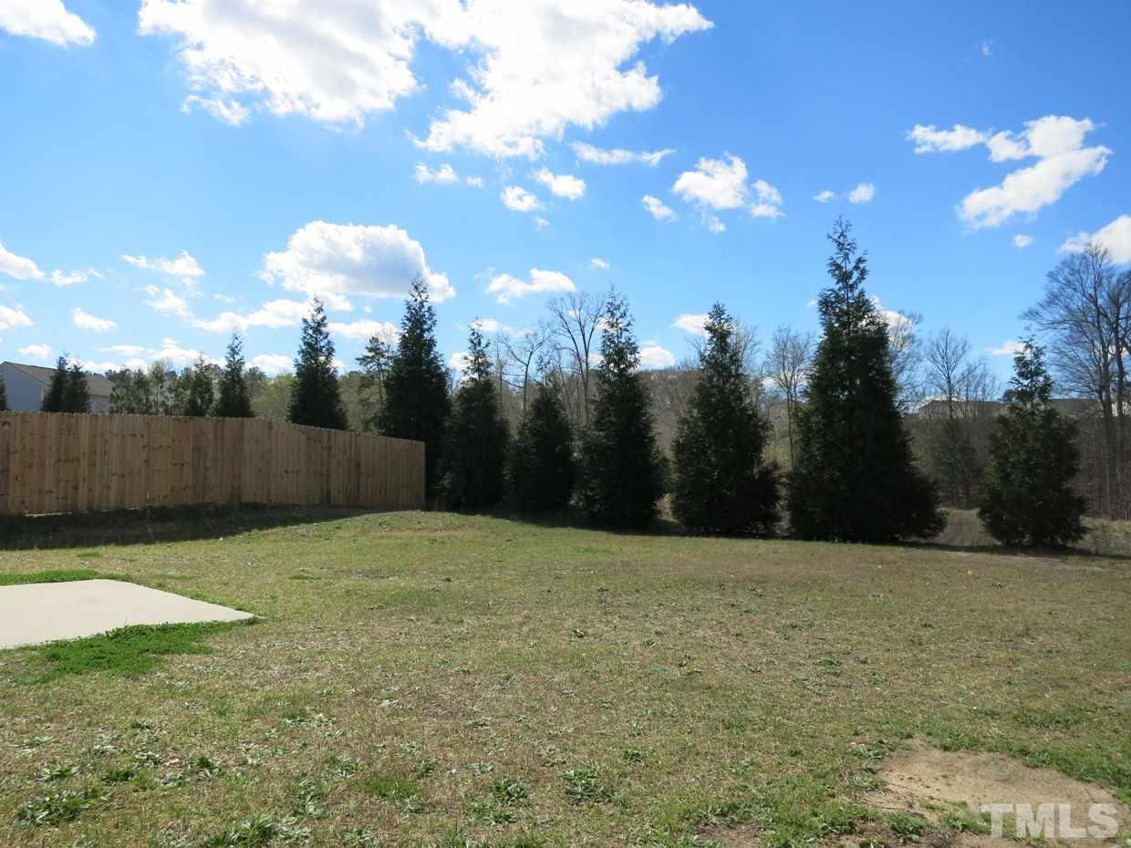 6714 Harter Court Raleigh, NC 27610 - Photo 24 of 25 The level backyard backs to a protected wooded buffer!