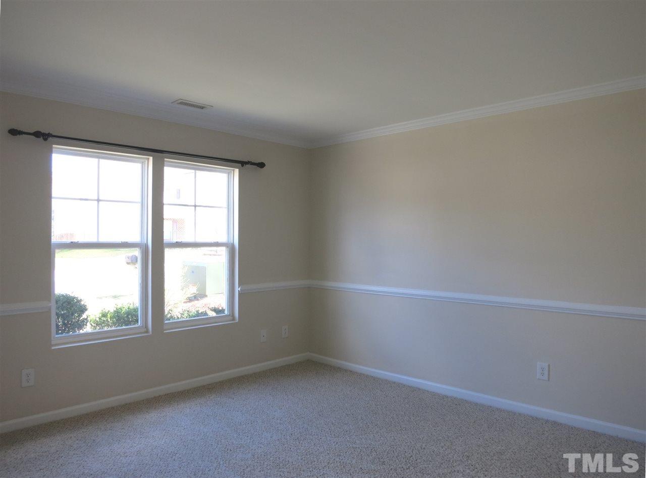 6714 Harter Court Raleigh, NC 27610 - Photo 4 of 25 Spacious formal Living Rm/Study w/neutral carpet & crown/chair rail molding is off the Foyer.