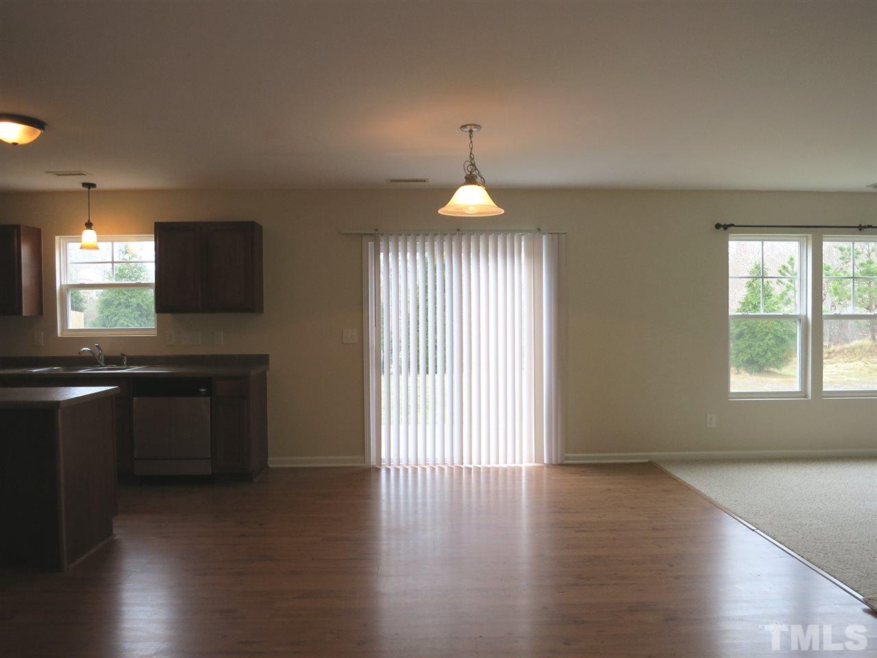 6714 Harter Court Raleigh, NC 27610 - Photo 9 of 25 The sunny B’fast area has a deep closet & sliders to the Patio.