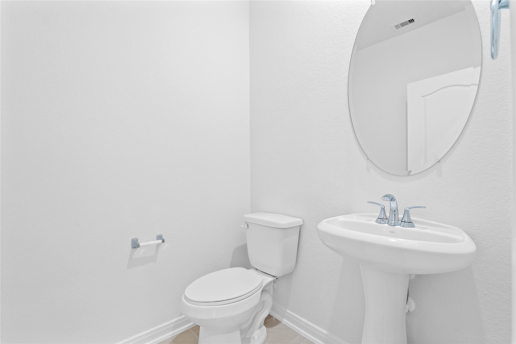 3519 Rocky Aspen Dr Spring Spring, TX 77373 - Photo 12 of 29 Perfectly situated on the main level for guests and residents, this charming powder room features a pedestal sink, mirror, and toilet.