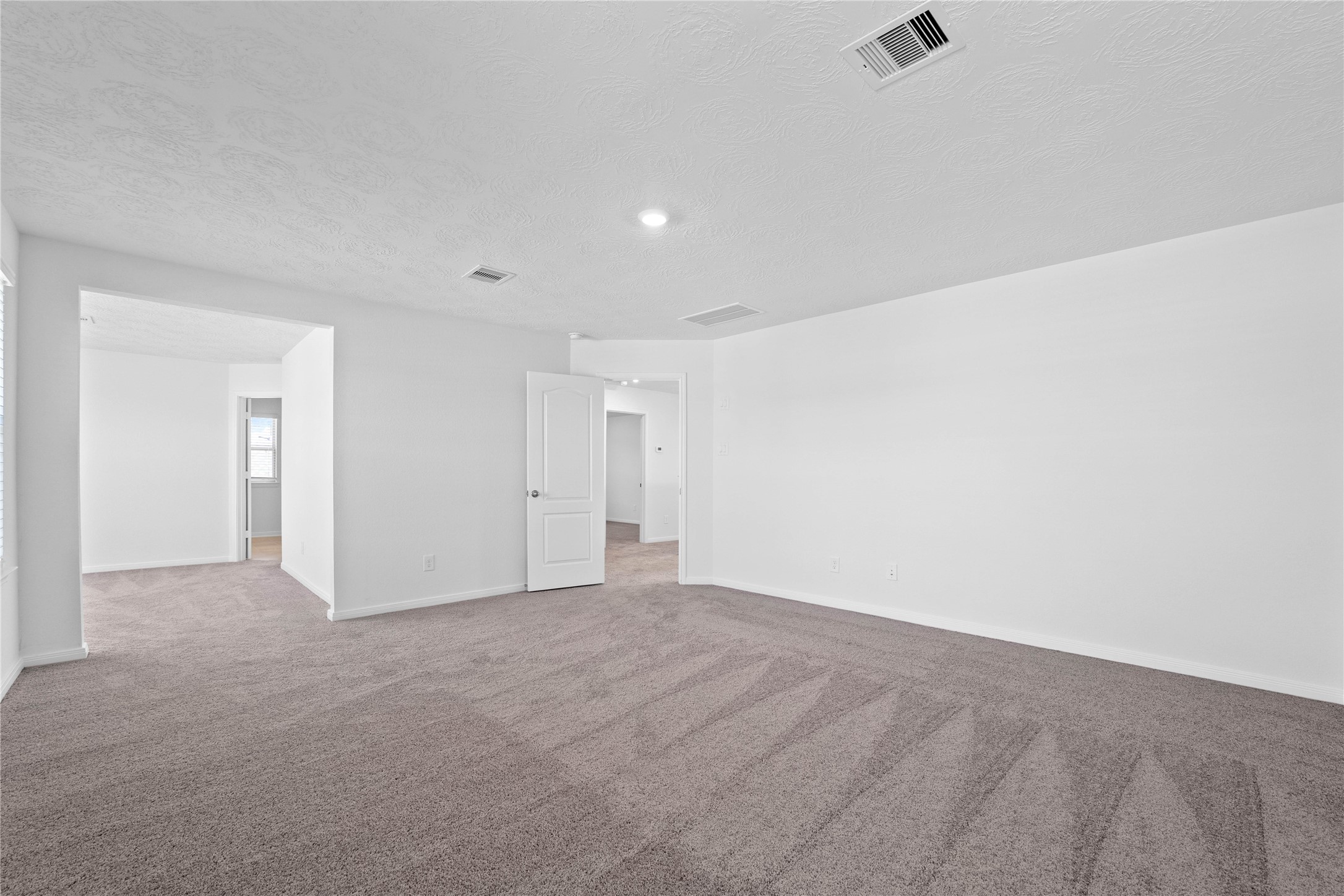 3519 Rocky Aspen Dr Spring Spring, TX 77373 - Photo 16 of 29 Another view from the primary bedroom looking to the sitting area that leads to the primary bathroom.