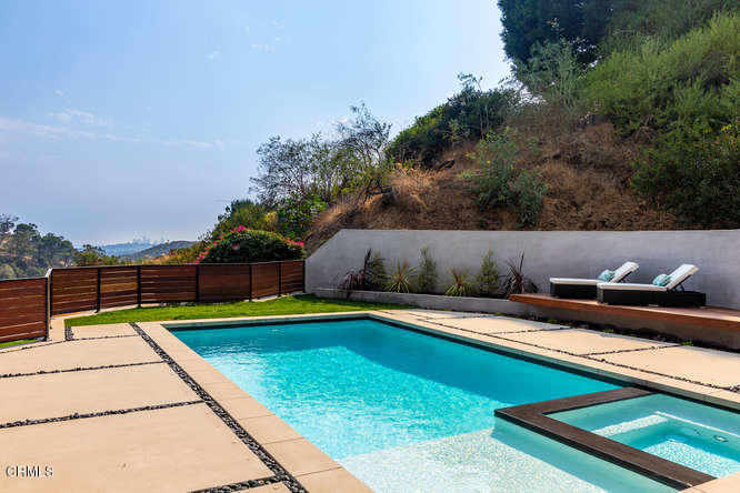 1375 Wierfield Drive Pasadena, CA 91105 - Photo 15 of 68 a swimming pool with outdoor seating and barbeque oven