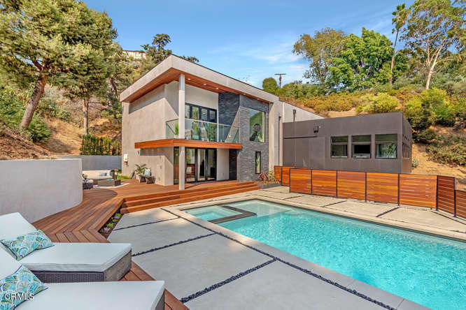 1375 Wierfield Drive Pasadena, CA 91105 - Photo 16 of 68 a view of a house with pool and chairs