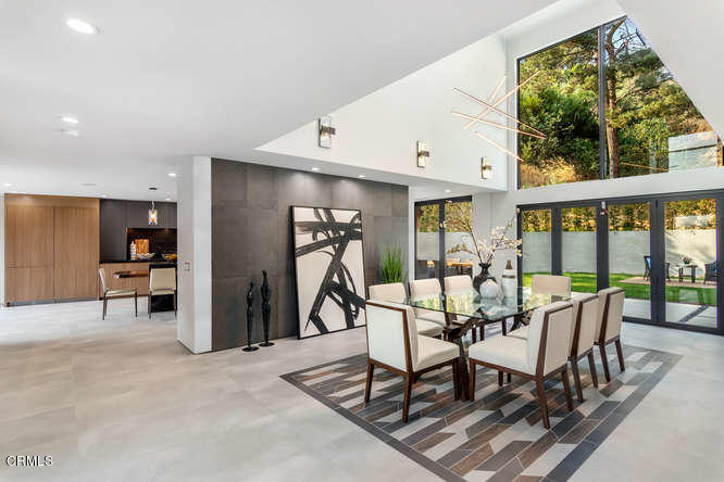 1375 Wierfield Drive Pasadena, CA 91105 - Photo 23 of 68 a view of a dining room with furniture water view and a floor to ceiling window
