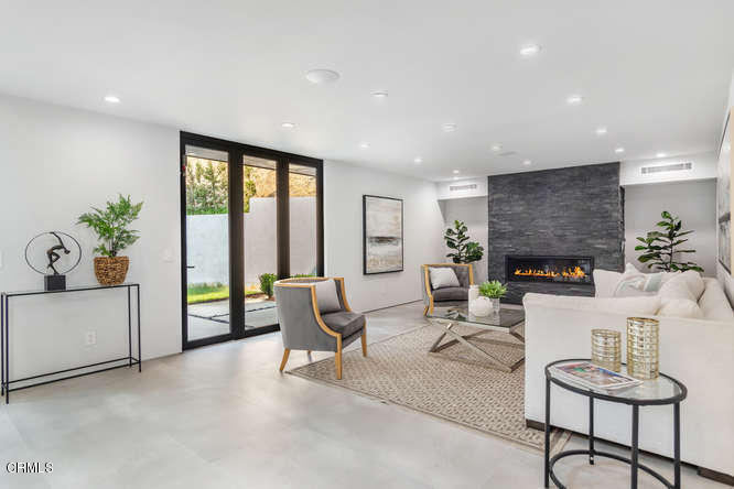 1375 Wierfield Drive Pasadena, CA 91105 - Photo 26 of 68 a living room with furniture and a fireplace