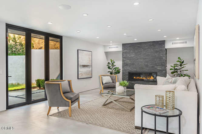 1375 Wierfield Drive Pasadena, CA 91105 - Photo 27 of 68 a living room with furniture and a fireplace