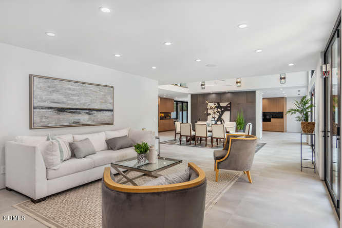 1375 Wierfield Drive Pasadena, CA 91105 - Photo 28 of 68 a living room with furniture and a dining table with wooden floor