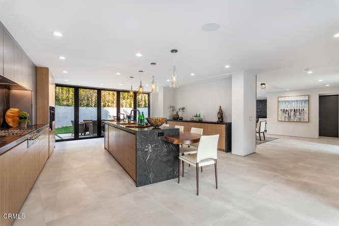 1375 Wierfield Drive Pasadena, CA 91105 - Photo 33 of 68 a living room with furniture and a large window