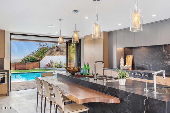 1375 Wierfield Drive Pasadena, CA 91105 - Photo 37 of 68 a kitchen with a table and chairs in it