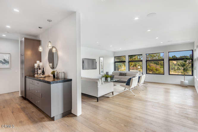 1375 Wierfield Drive Pasadena, CA 91105 - Photo 44 of 68 a living room with furniture and large windows