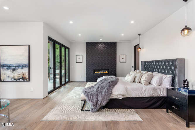 1375 Wierfield Drive Pasadena, CA 91105 - Photo 52 of 68 a bedroom with a bed and a couch