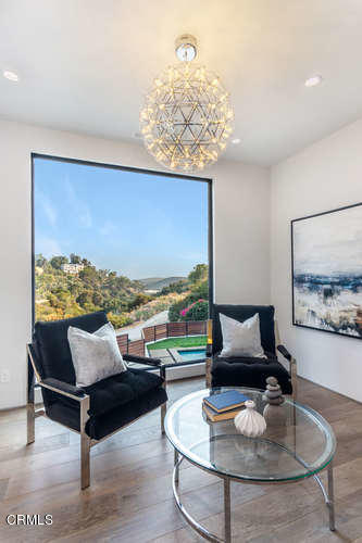 1375 Wierfield Drive Pasadena, CA 91105 - Photo 54 of 68 a living room with furniture and a floor to ceiling window