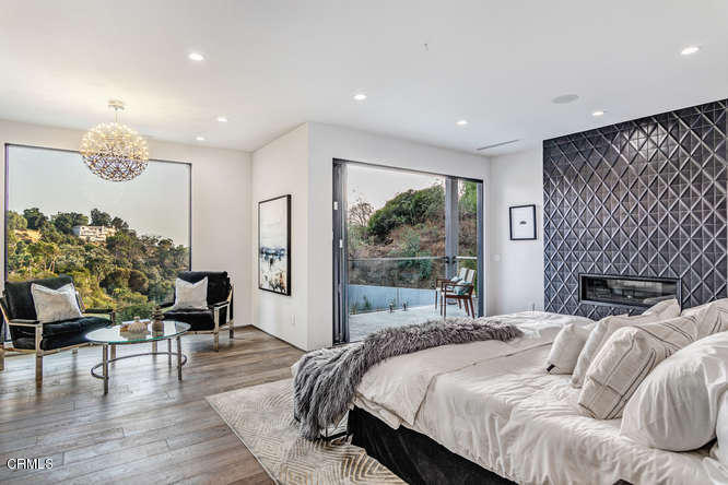 1375 Wierfield Drive Pasadena, CA 91105 - Photo 59 of 68 a bedroom with a bed and a large window