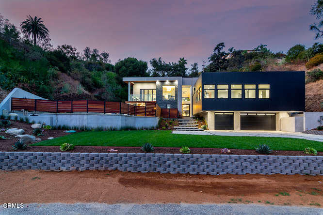1375 Wierfield Drive Pasadena, CA 91105 - Photo 66 of 68 a front view of a house with a yard and a garden