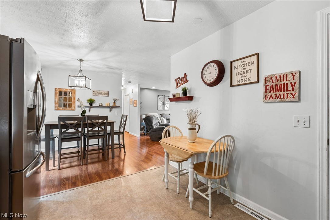 9935 Fair Road Strongsville, OH 44149 - Photo 13 of 34 Dining space with a textured ceiling and light carpet