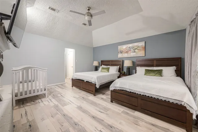 a bedroom with a bed and a table in it