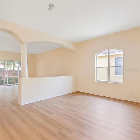 a bedroom with two beds and a window