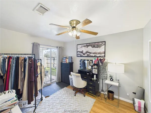 a living room with lots of furniture and a rug