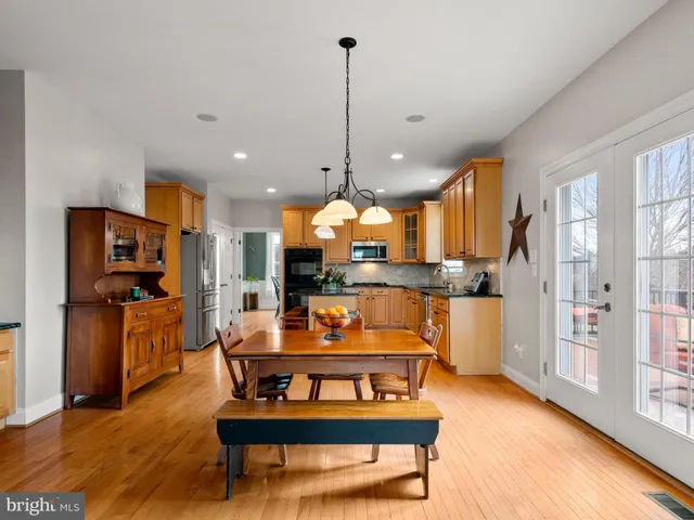 a kitchen with a refrigerator and cabinets